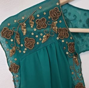 Green anthropology dress with gold beading